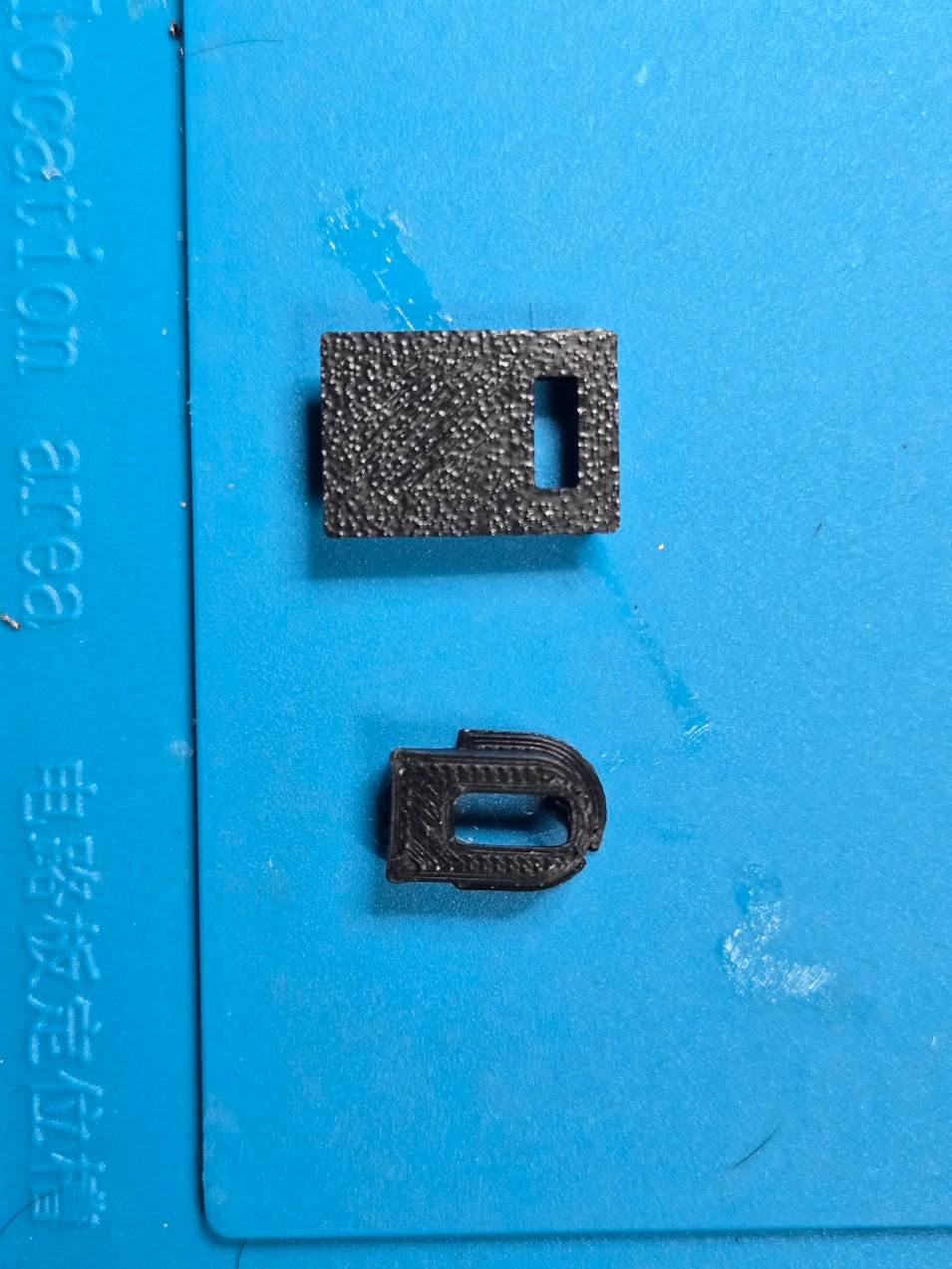 Current rectangular and arched USB-C charging inserts printed in black PLA