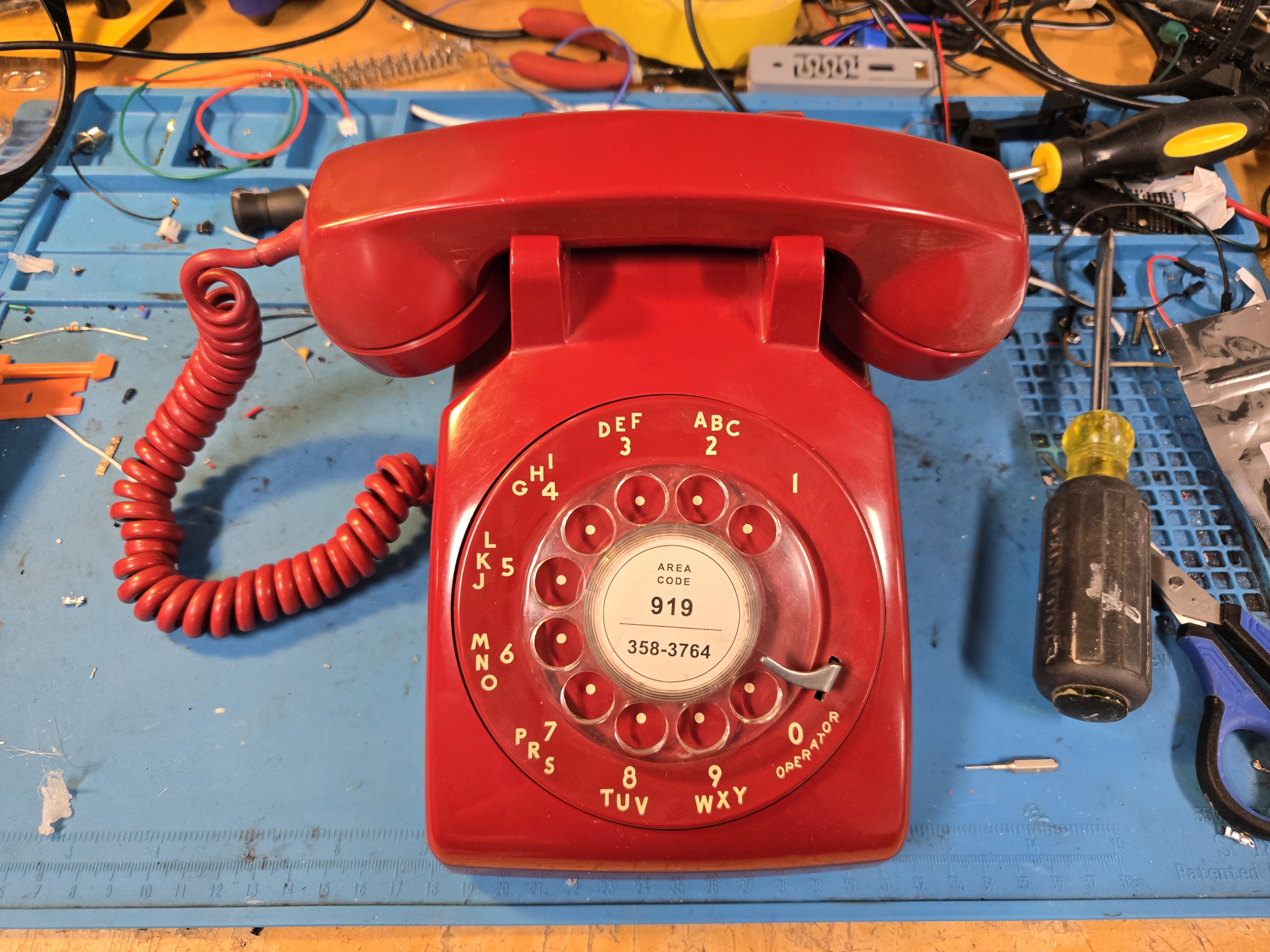 Completed red RotaryCell telephone assembled and ready for use