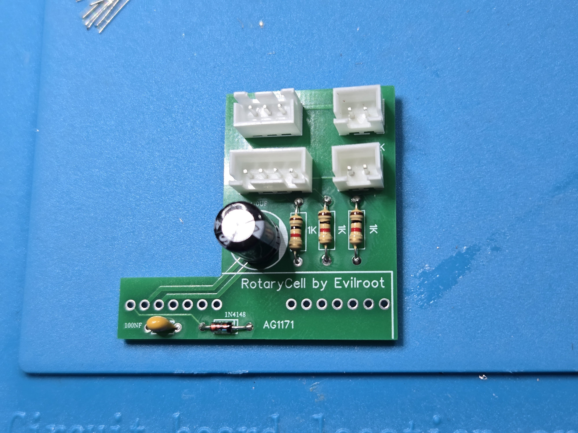 Carrier populated with the capacitor, diode, resistors and four connectors