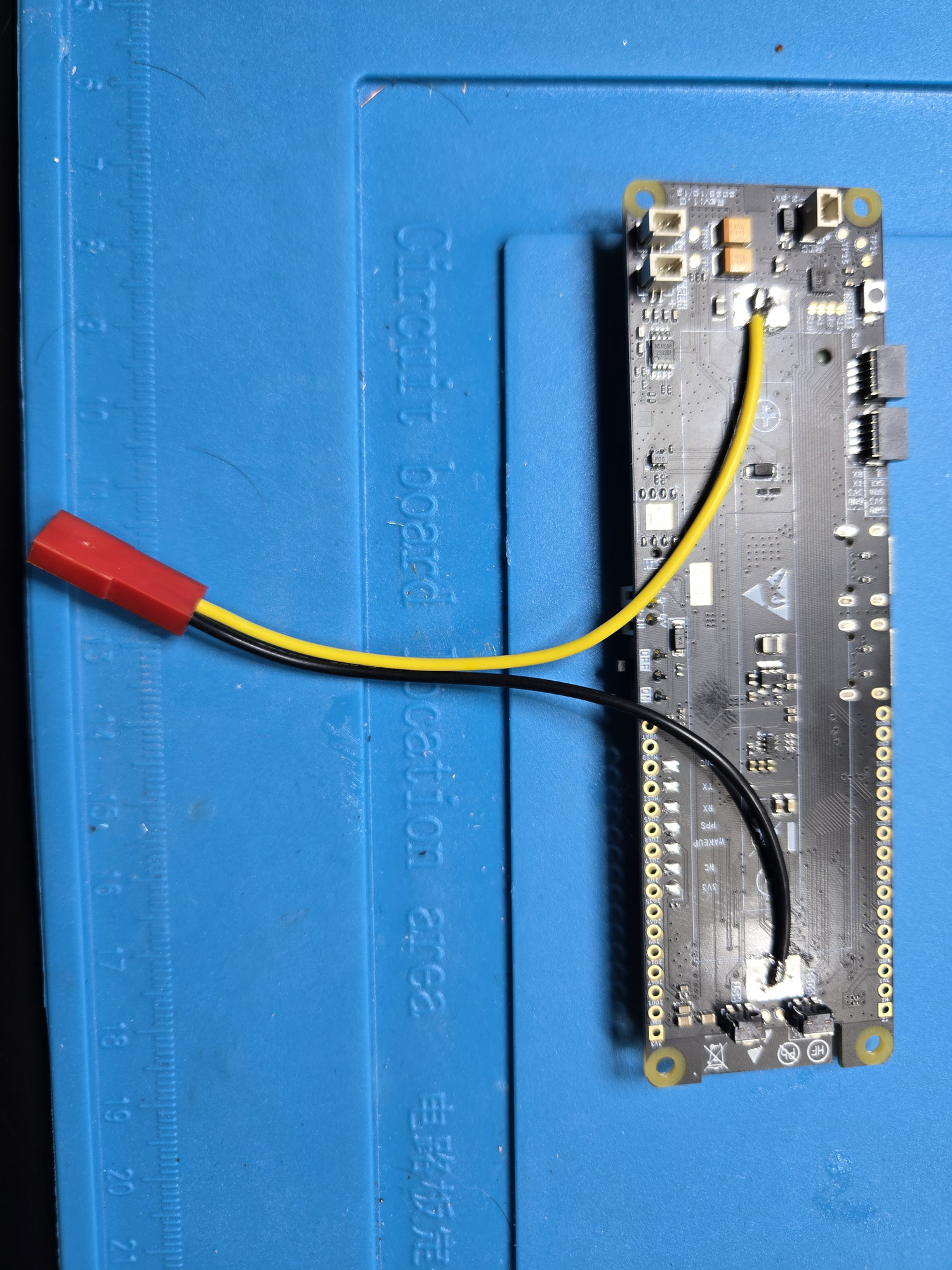 Yellow battery-positive and black battery-negative leads attached after removal of the original holder