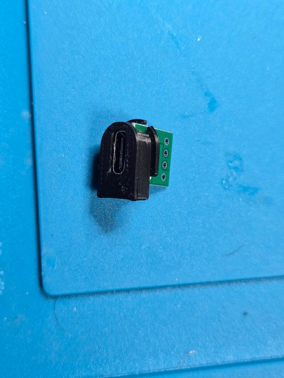 Arch R1 insert assembled around a USB-C breakout board